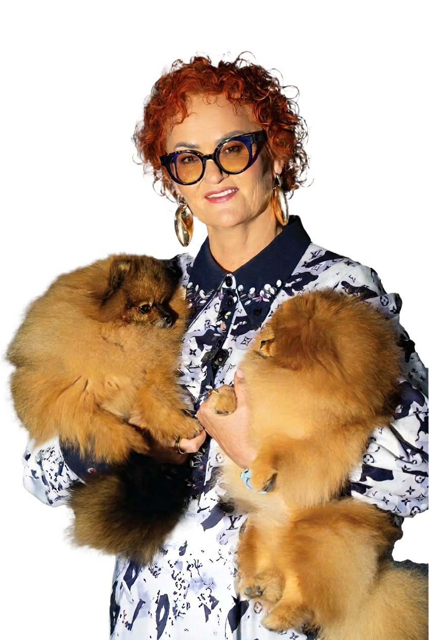 Portrait of lecturer Janita Januškauskaitė-Plungė holding two Pomeranians
