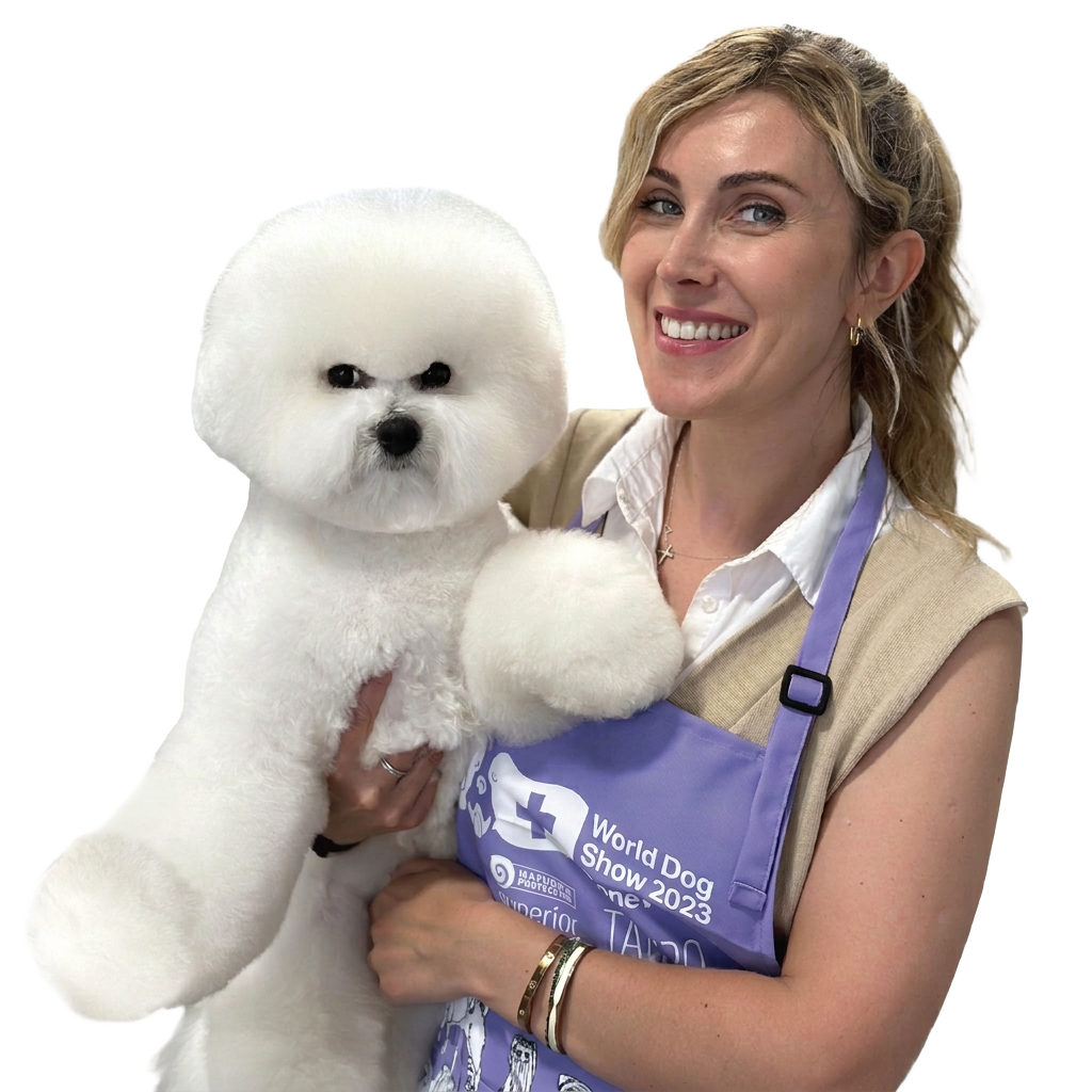 Portrait of lecturer Kamilė Ausmanė holding a white Bichon Frisé
