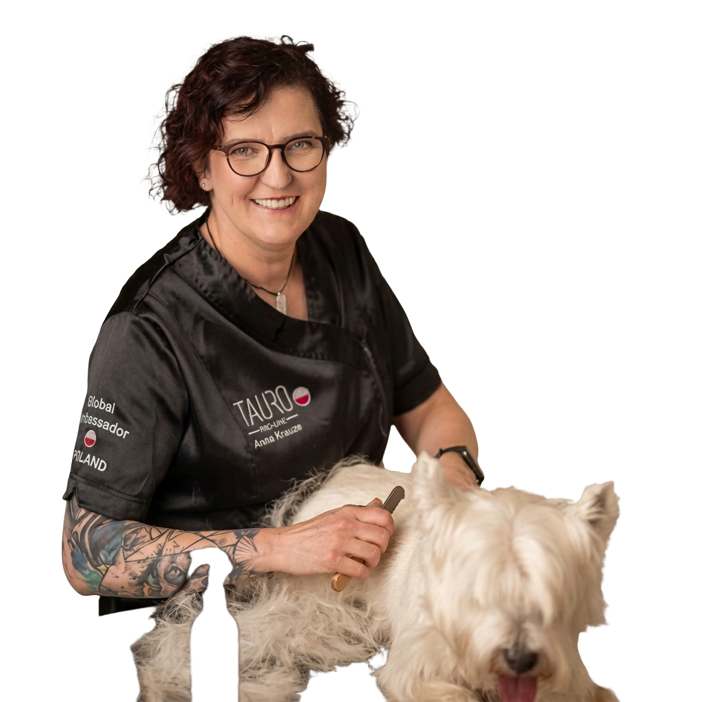 Portrait of lecturer Anna Krauze grooming a West Highland White Terrier